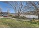 Scenic lake view with a kayak storage rack and a well-maintained grassy shoreline at 120 Hornbeam Ln, Mooresville, NC 28117