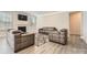 Open-concept living room featuring sleek furniture, a cozy fireplace, and ample natural light at 120 Hornbeam Ln, Mooresville, NC 28117