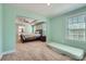 Spacious main bedroom with ceiling fan, tray ceiling and a connecting bathroom at 120 Hornbeam Ln, Mooresville, NC 28117