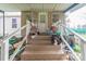 A rear covered entrance with brick steps leads into this cozy home; note the clutter on the porch at 1216 Center St, Wadesboro, NC 28170