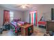 Bedroom featuring natural light, ceiling fan, and bed with wooden frame at 1216 Center St, Wadesboro, NC 28170