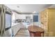 Bright kitchen featuring white cabinets, modern appliances, and a cozy dining area at 1216 Center St, Wadesboro, NC 28170