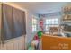 Well-lit storage area with multiple windows and a view of the backyard at 1216 Center St, Wadesboro, NC 28170