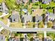 Aerial view shows the home, the pool, and the surrounding neighborhood at 127 Oxford Dr, Mooresville, NC 28115