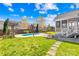 Fenced backyard features a patio, a pool, a firepit, and a pergola with a swing at 127 Oxford Dr, Mooresville, NC 28115