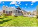Expansive backyard featuring a private pool, well-maintained lawn, and a charming screened porch at 127 Oxford Dr, Mooresville, NC 28115