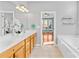 Bathroom with double vanity and an open view into the bedroom at 127 Oxford Dr, Mooresville, NC 28115
