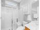 Bathroom featuring a glass enclosed shower with a built-in seat, a toilet, and vanity with sink at 127 Oxford Dr, Mooresville, NC 28115
