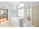 Bright bathroom featuring a modern shower, soaking tub, and ample natural light at 127 Oxford Dr, Mooresville, NC 28115