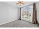 Bedroom with neutral carpet, a large window, and modern ceiling fan at 127 Oxford Dr, Mooresville, NC 28115