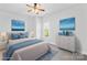 Virtually staged bedroom with neutral walls, plush carpet, a ceiling fan and a window overlooking the outside at 127 Oxford Dr, Mooresville, NC 28115