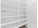 Bright and organized walk-in closet with multiple shelves for clothing and storage at 127 Oxford Dr, Mooresville, NC 28115