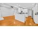 Modern kitchen boasts stainless steel appliances, white cabinetry, and a convenient breakfast bar area at 127 Oxford Dr, Mooresville, NC 28115