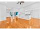 Bright and airy living room with hardwood floors, open layout, and connection to the kitchen area at 127 Oxford Dr, Mooresville, NC 28115