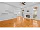 Open-concept living room with hardwood floors, a fireplace, and ample natural light, perfect for gatherings at 127 Oxford Dr, Mooresville, NC 28115