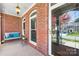 Inviting front porch with a swing, perfect for relaxing and enjoying the outdoors at 127 Oxford Dr, Mooresville, NC 28115