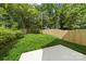 Expansive backyard featuring a well-maintained lawn and wooden fence, offering privacy and space for outdoor activities at 1322 Condon St, Charlotte, NC 28216