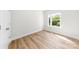 A bright bedroom featuring wood-look floors and a window offering lots of natural light at 1322 Condon St, Charlotte, NC 28216