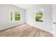Bright bedroom with hardwood floors, and two windows at 1322 Condon St, Charlotte, NC 28216