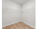This closet features wood-look floors and metal shelving at 1322 Condon St, Charlotte, NC 28216