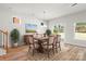 Bright dining room featuring a hardwood table, a sliding glass door, and ample natural light at 1322 Condon St, Charlotte, NC 28216