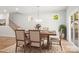 Elegant dining area featuring a hardwood table, staircase, and natural light at 1322 Condon St, Charlotte, NC 28216