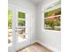 Bright entryway features a modern glass door and a large window overlooking the front yard at 1322 Condon St, Charlotte, NC 28216