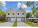 Modern townhouse featuring two stories, a symmetrical facade, a private garage, and a well-manicured lawn at 1322 Condon St, Charlotte, NC 28216