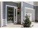 A modern townhome front entrance with a gray door, mailbox, and address number '1322' at 1322 Condon St, Charlotte, NC 28216