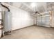 An empty garage featuring a water heater and an automatic door at 1322 Condon St, Charlotte, NC 28216