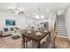 Open-concept living room and kitchen, perfect for entertaining with a dining table and a cozy sitting area at 1322 Condon St, Charlotte, NC 28216