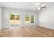 Bright living room featuring hardwood floors, glass doors to the back yard and natural lighting at 1322 Condon St, Charlotte, NC 28216