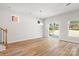 Spacious living room featuring hardwood floors and staircase at 1322 Condon St, Charlotte, NC 28216