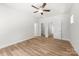 This main bedroom features clean, neutral walls and wood-look floors at 1322 Condon St, Charlotte, NC 28216