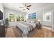 Spacious main bedroom featuring a ceiling fan, natural light, and ensuite bathroom access at 1322 Condon St, Charlotte, NC 28216