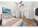 This main bedroom offers a large tv, neutral walls, and wood-look floors at 1322 Condon St, Charlotte, NC 28216