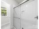 Modern shower with a glass door and a subway tile surround at 1322 Condon St, Charlotte, NC 28216