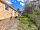 View of the backyard featuring a chain link fence and small shed at 1327 Santee St, Charlotte, NC 28208