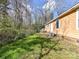 Fenced backyard view with lawn and mature trees at 1327 Santee St, Charlotte, NC 28208