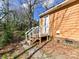 Home exterior with a small set of stairs leading up to the door at 1327 Santee St, Charlotte, NC 28208