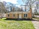Single-story home with a neatly manicured lawn and a simple yet elegant exterior, offering a welcoming ambiance at 1327 Santee St, Charlotte, NC 28208