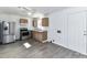Spacious kitchen with stainless appliances, ample cabinets, and a door to outside at 1327 Santee St, Charlotte, NC 28208
