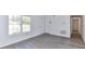 Inviting living room with modern flooring and white walls, offering plenty of natural light, and creating a cozy atmosphere at 1327 Santee St, Charlotte, NC 28208