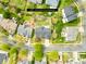 This is an aerial view of a home and property located on a tree lined street in a residential neighborhood at 13514 Porter Creek Rd, Charlotte, NC 28262