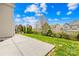 Spacious backyard with a concrete patio, offering a great space for outdoor gatherings at 13514 Porter Creek Rd, Charlotte, NC 28262