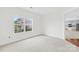 Bright bedroom features a large window with a view and neutral carpeting at 13514 Porter Creek Rd, Charlotte, NC 28262