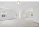 Spacious bonus room with natural light from large windows, perfect for entertaining or relaxing at 13514 Porter Creek Rd, Charlotte, NC 28262