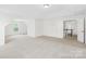 Expansive bonus room with bright, neutral walls and multiple windows for lots of natural light at 13514 Porter Creek Rd, Charlotte, NC 28262