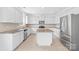 Modern kitchen with stainless steel appliances and granite island at 13514 Porter Creek Rd, Charlotte, NC 28262