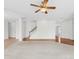 Large living room with stairs and wood floor accents at 13514 Porter Creek Rd, Charlotte, NC 28262